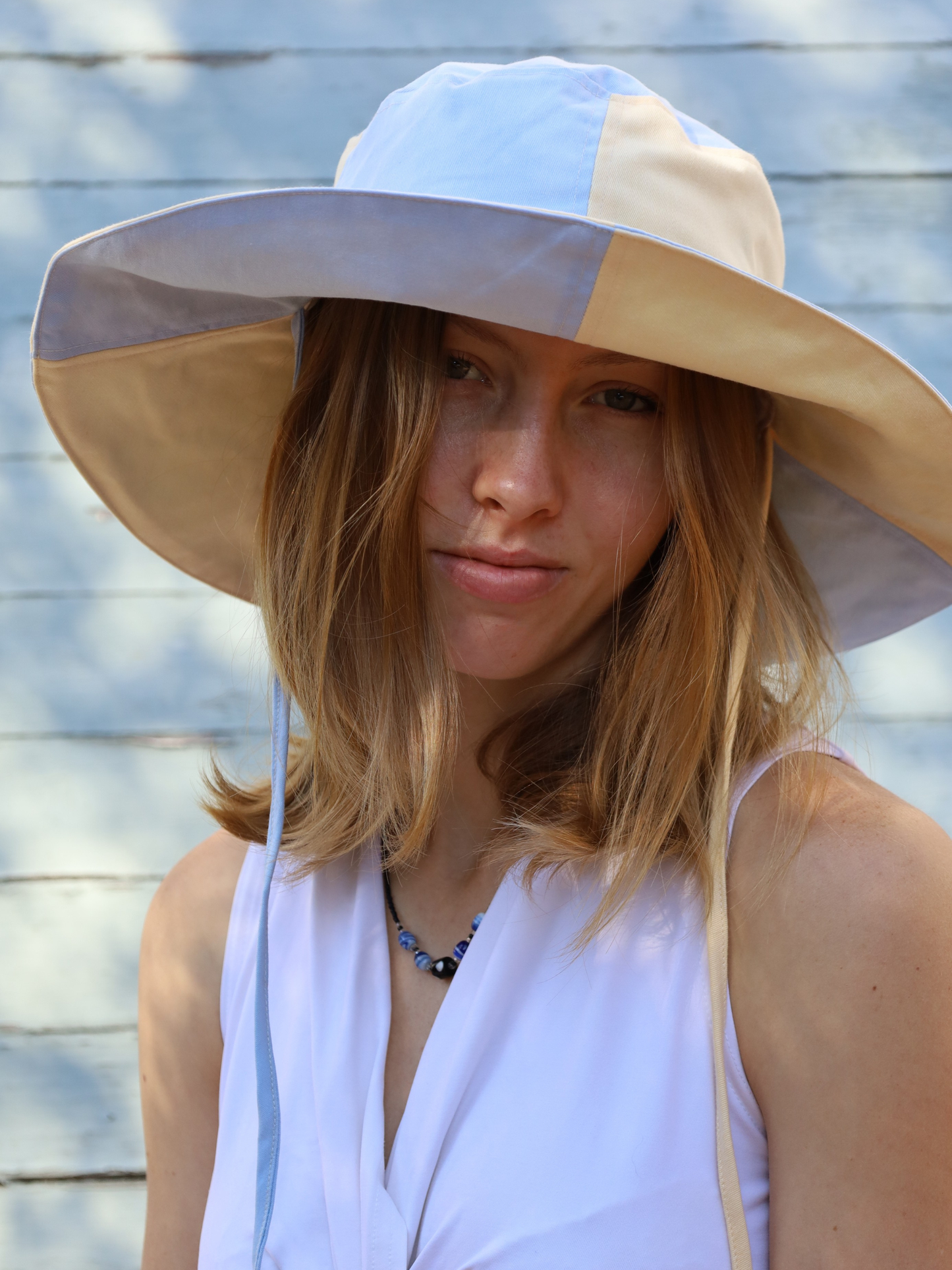 Wide brimmed Sun hat in blue and yellow colour blocking. Made in SA by Morals the brand