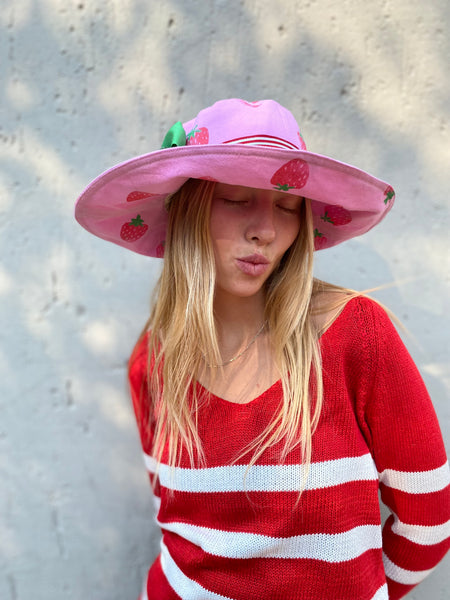 strawberry hat with green removable bow