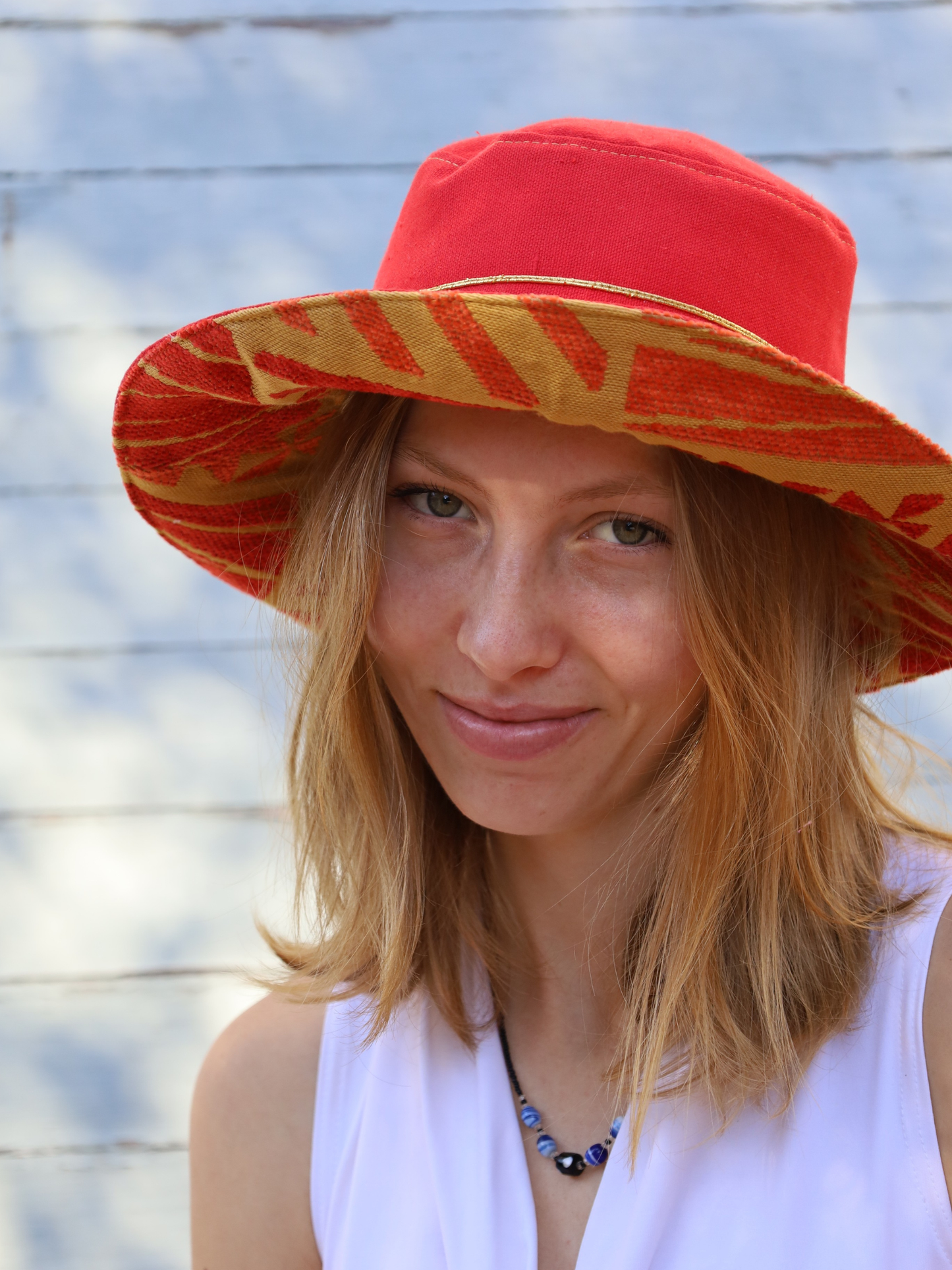 Red Midi Sun Hat with gold and orange under the brim. Made in SA