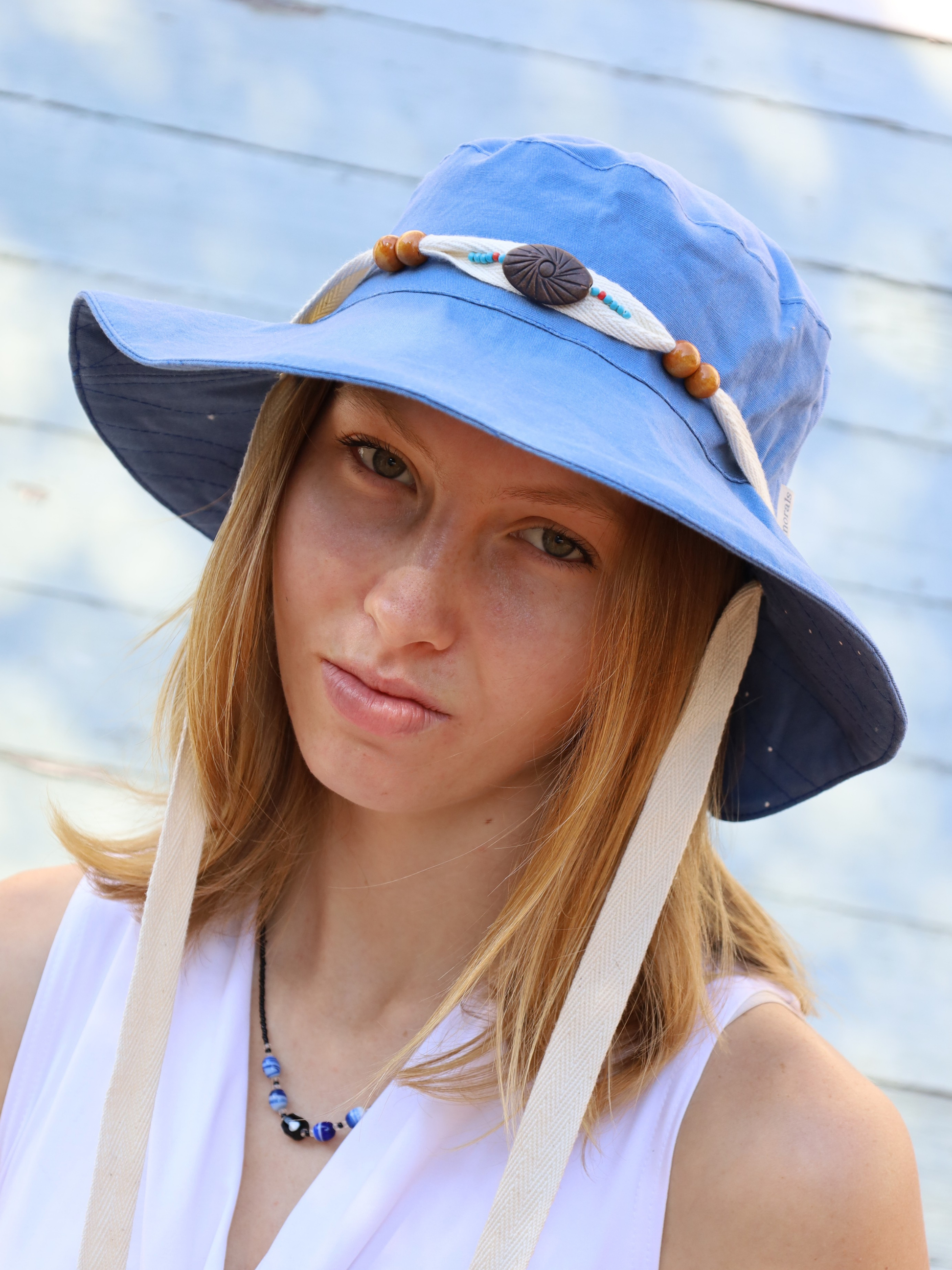 Blue midi sun hat made in South Africa. Wooden bead details