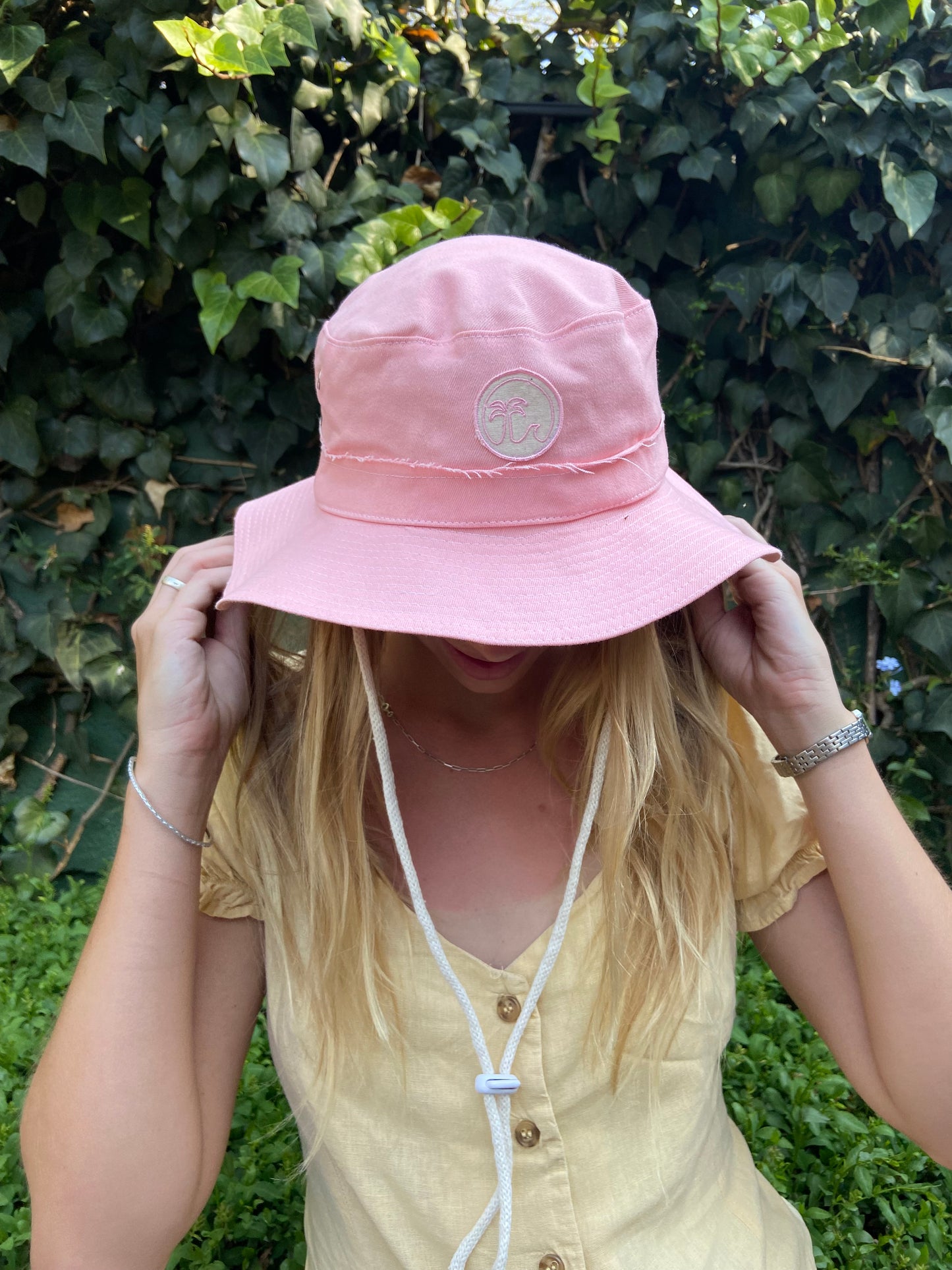 Wide brimmed Peach Patch Hat with morald the brand logo patch 