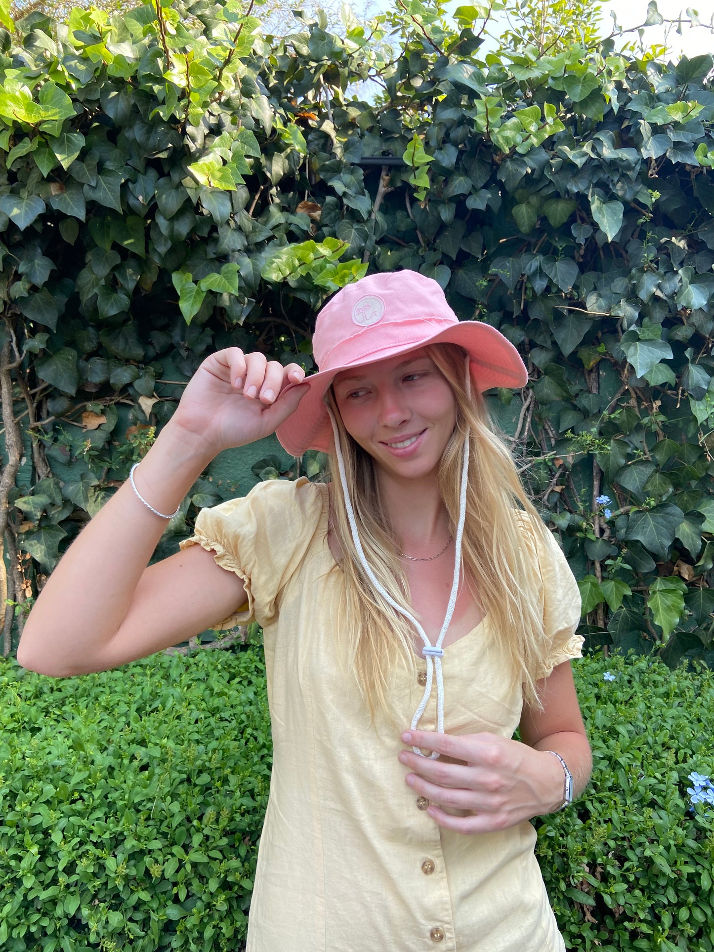 Handmade hat with Morals the brand Logo in peach pink