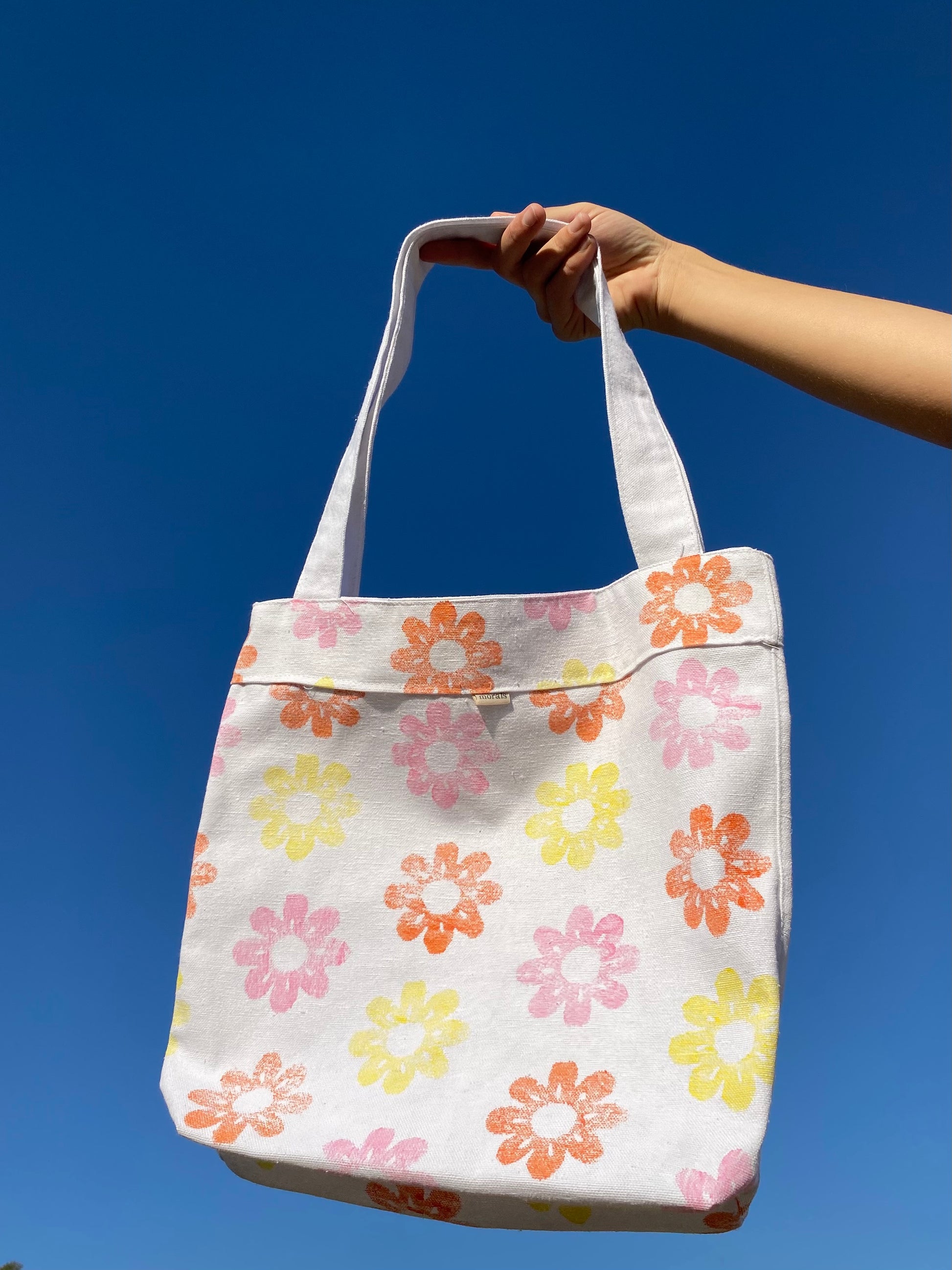 Handmade tote bag by morals the brand with pink, yellow and orange flowers